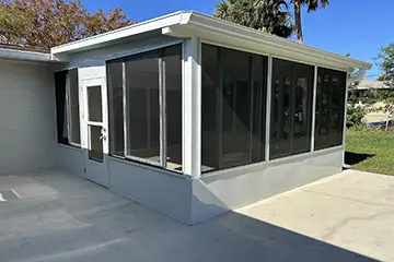 Screen room with sliding windows by East Coast Aluminum